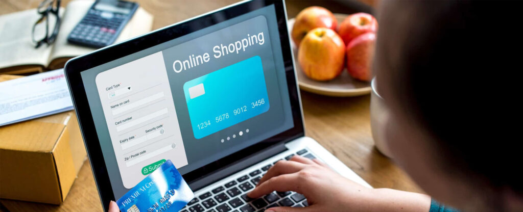 Person doing online shopping on laptop