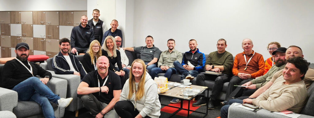 Happy group of colleagues in a meeting room.