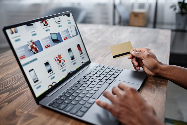 Online shopping with laptop and credit card.